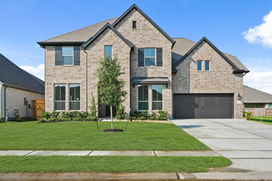 Front exterior of a new home in Coastal Point, League City, TX, highlighting curb appeal (Image 2).