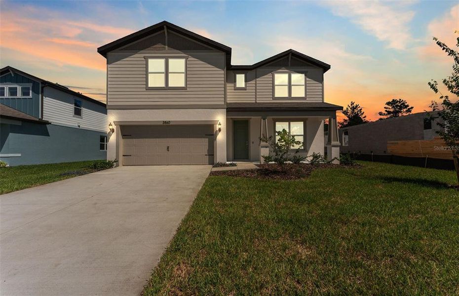 Front exterior of a new home in Caldera, Spring Hill, FL, highlighting curb appeal (Image 19).