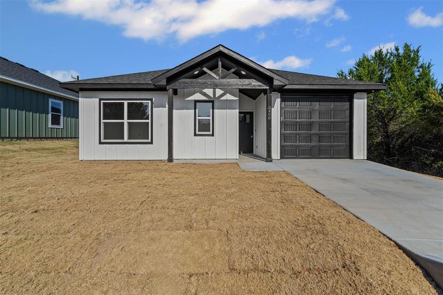 Front exterior of a new home in , Granbury, TX, highlighting curb appeal (Image 22).
