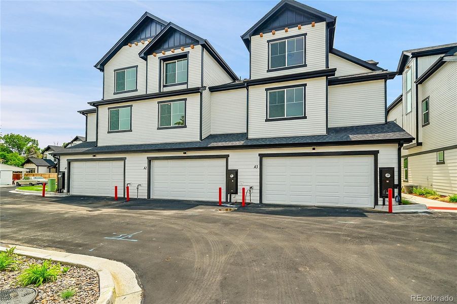 Front exterior of a new home in , Arvada, CO, highlighting curb appeal (Image 1).