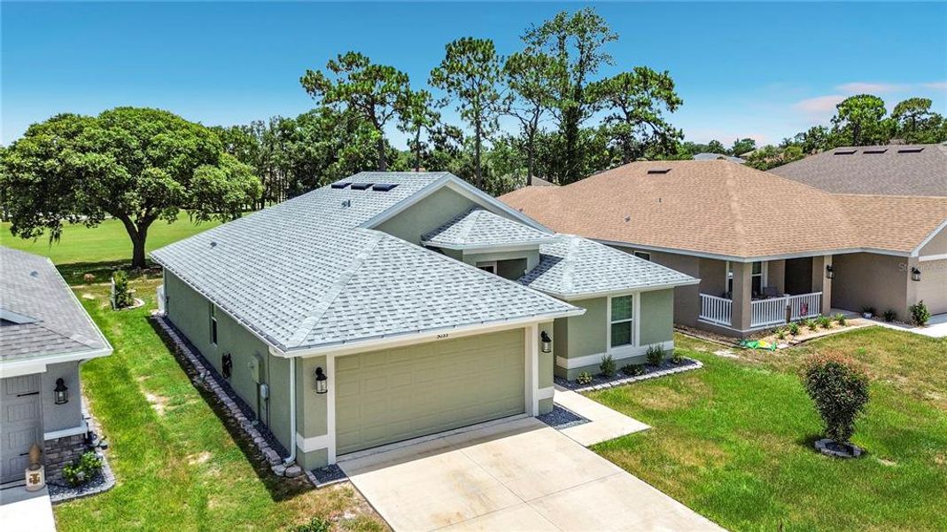 Front exterior of a new home in Twisted Oaks, Beverly Hills, FL, highlighting curb appeal (Image 22). Front exterior of a new home in Twisted Oaks, Beverly Hills, FL, highlighting curb appeal (Image 22).