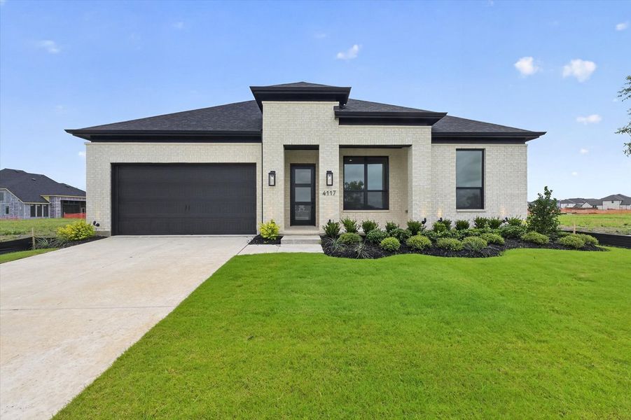 Front exterior of a new home in Mosaic, Celina, TX, highlighting curb appeal (Image 1). Front exterior of a new home in Mosaic, Celina, TX, highlighting curb appeal (Image 1).