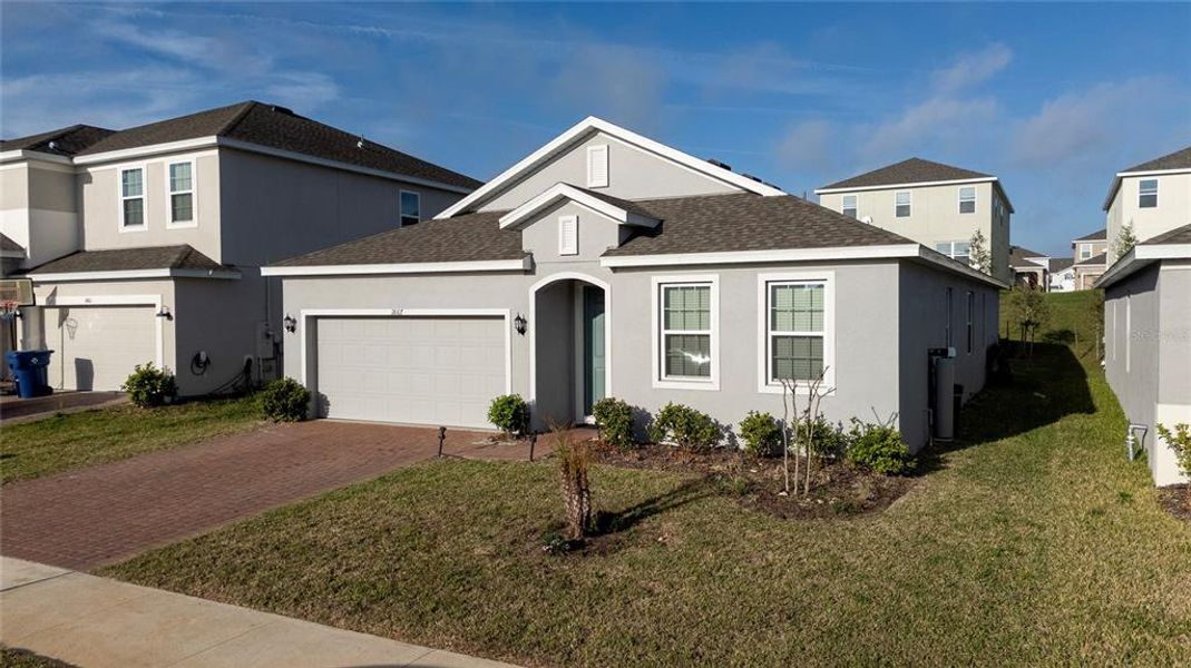Front exterior of a new home in , Groveland, FL, highlighting curb appeal (Image 22).