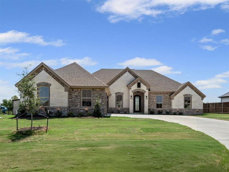 Front exterior of a new home in , Godley, TX, highlighting curb appeal (Image 19).