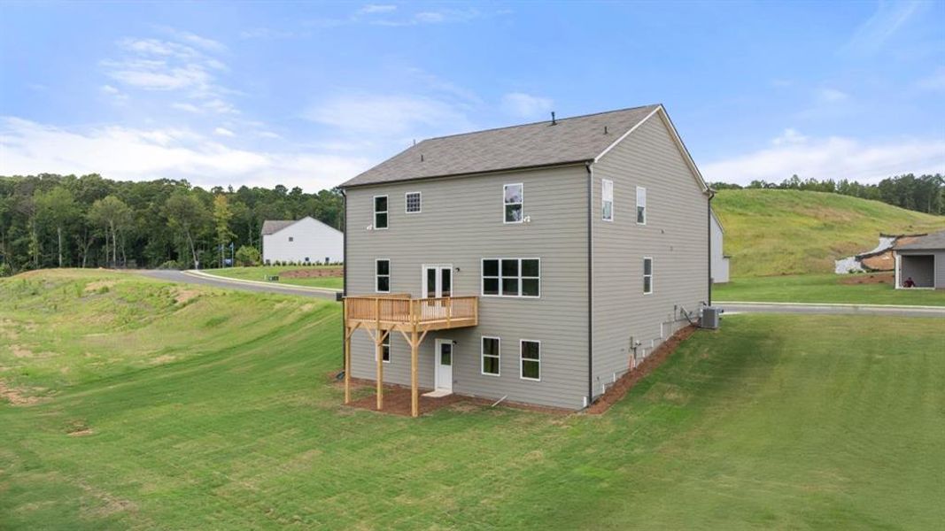 Front exterior of a new home in Sheffield Highlands, Dallas, GA, highlighting curb appeal (Image 20).