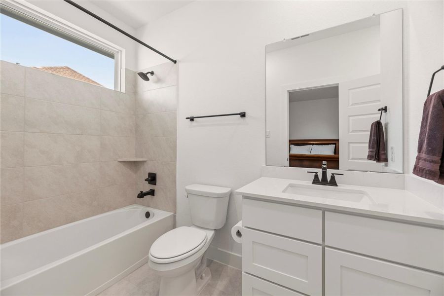 Furnished interior view inside a new home in Bridgeland, Cypress (Image 34).