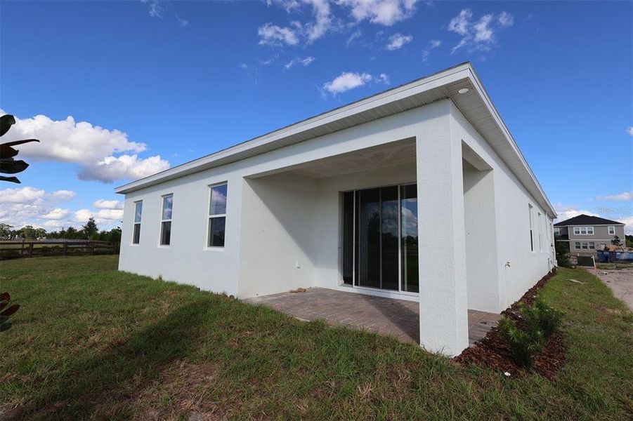 Exterior details and patio area of a home in Bay Lake Farms, St. Cloud (Image 3).