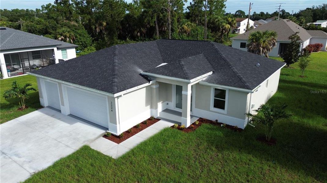 Front exterior of a new home in , North Port, FL, highlighting curb appeal (Image 21).