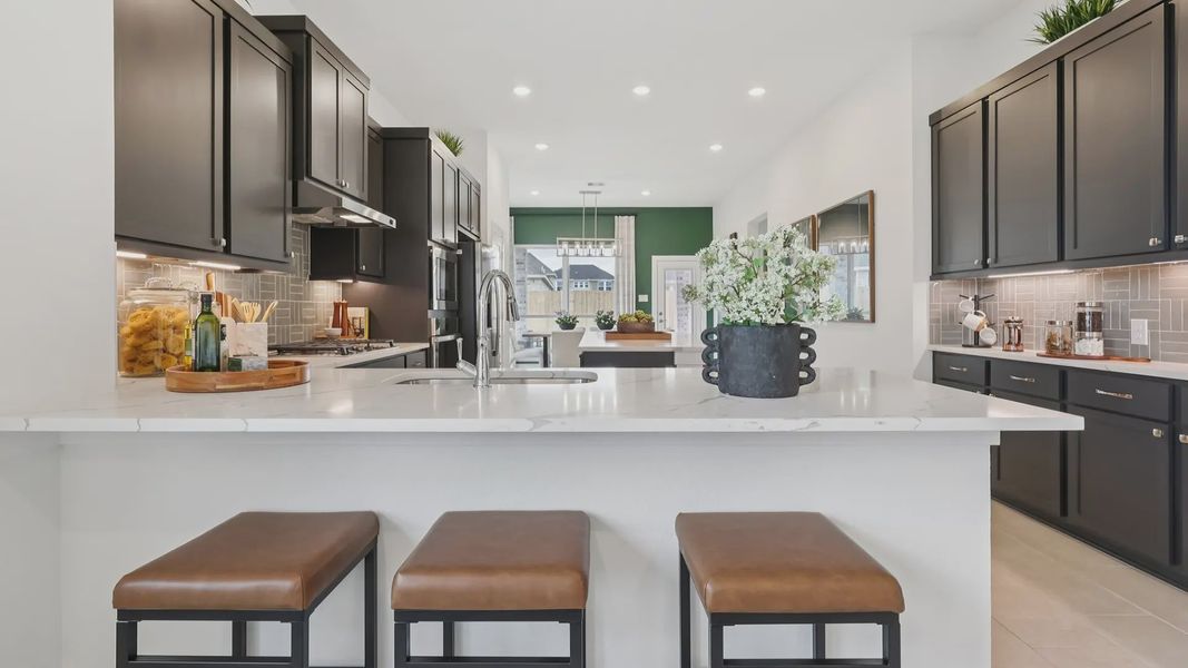 Representative furnished interior of a home built from the Adele by Chesmar Homes in Sunterra, Katy (Image 8).