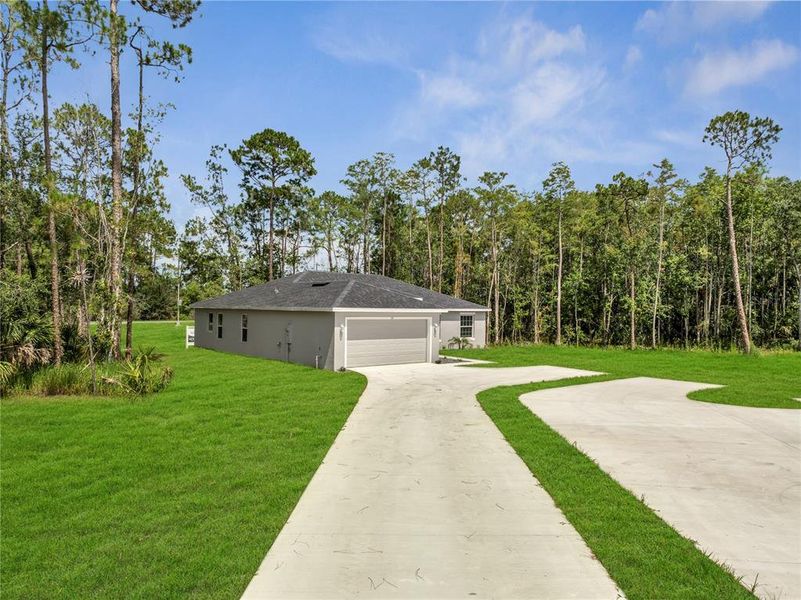 Front exterior of a new home in , Kissimmee, FL, highlighting curb appeal (Image 25).