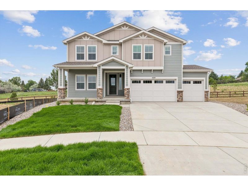 Front exterior of a new home in Country Club Reserve – Fort Collins, Fort Collins, CO, highlighting curb appeal (Image 1). Front exterior of a new home in Country Club Reserve – Fort Collins, Fort Collins, CO, highlighting curb appeal (Image 1).