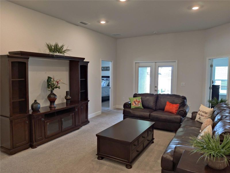 Furnished interior view inside a new home in Sunset Landing, Spring Hill (Image 7).