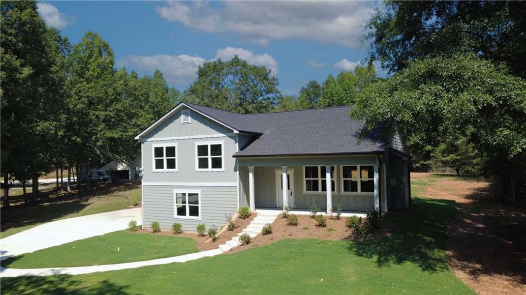 Front exterior of a new home in , Covington, GA, highlighting curb appeal (Image 20).
