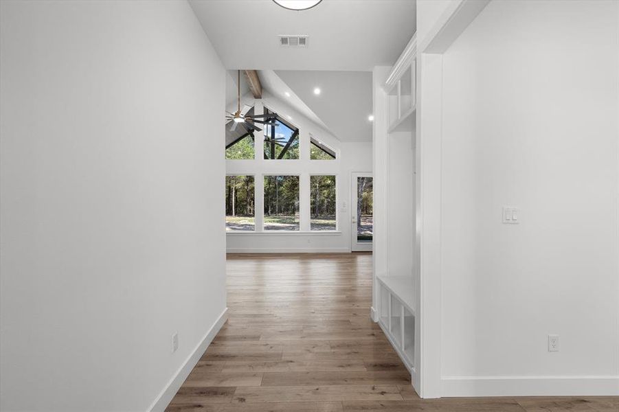 Hallway featuring light wood-style flooring and recessed lighting