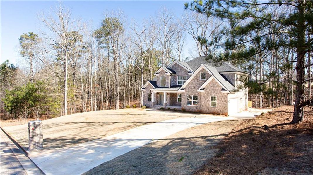 Front exterior of a new home in , McDonough, GA, highlighting curb appeal (Image 23).