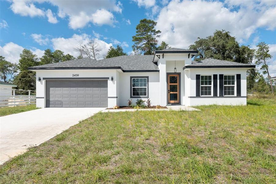 Front exterior of a new home in , Ocala, FL, highlighting curb appeal (Image 1). Front exterior of a new home in , Ocala, FL, highlighting curb appeal (Image 1).