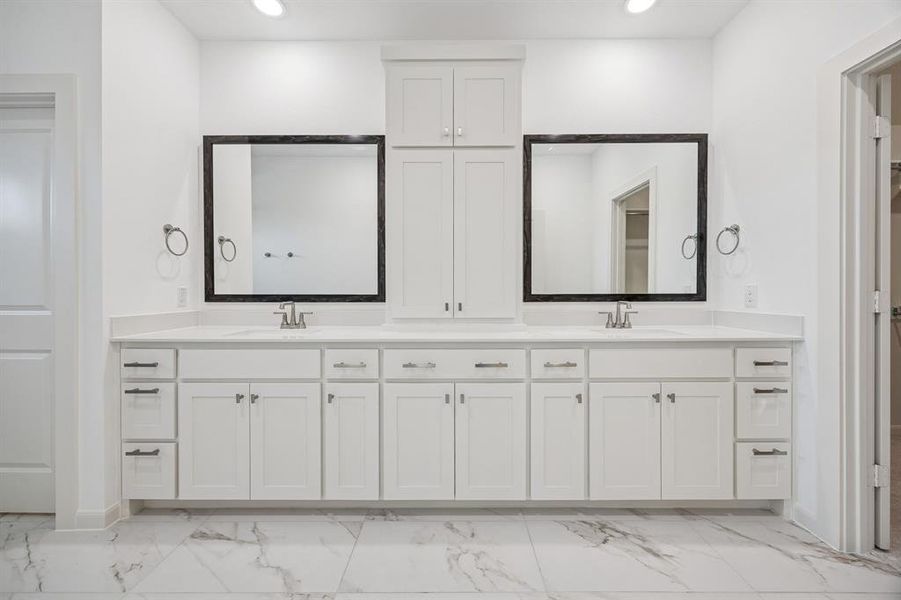 There is ample space for two in this lovely owner's bath!