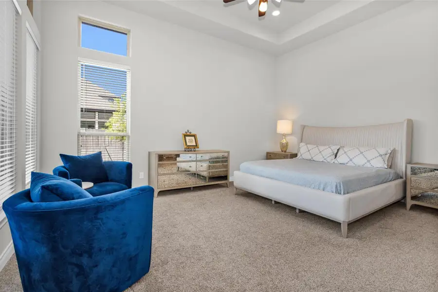 The private primary suite, large enough for a seating area.