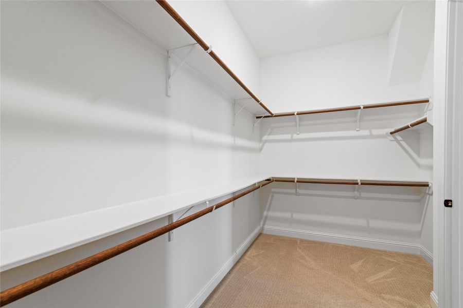 Spacious walk-in closet in the primary bedroom.