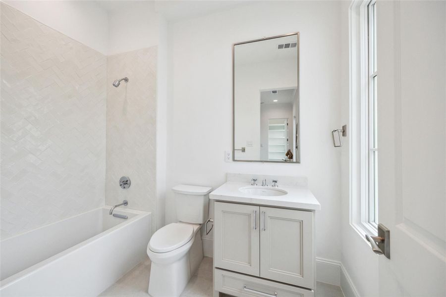 En-suite bath to feature Kohler bath and vanity with under-cabinet storage. **Photo is of another home in the community and for information purposes only. Buyer to verify all details.** En-suite bath to feature Kohler bath and vanity with under-cabinet storage. **Photo is of another home in the community and for information purposes only. Buyer to verify all details.**