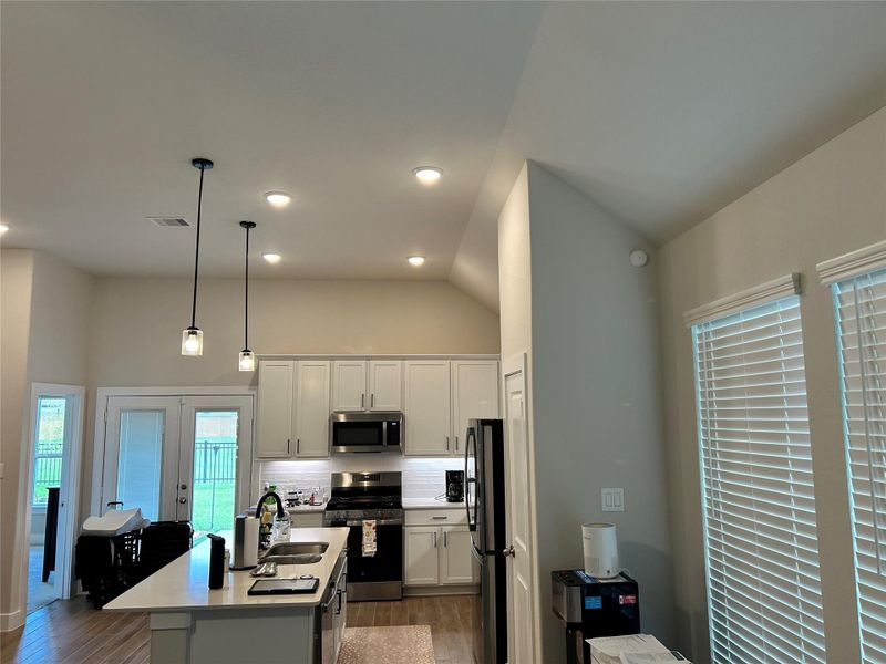 Open-Concept Kitchen — Bright, open-concept kitchen seamlessly connected to the main living areas, creating an inviting space for everyday living and entertaining.