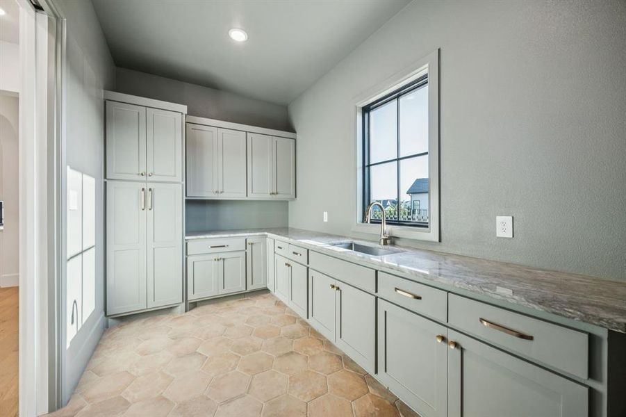 Laundry room featuring a sink and recessed lighting Laundry room featuring a sink and recessed lighting