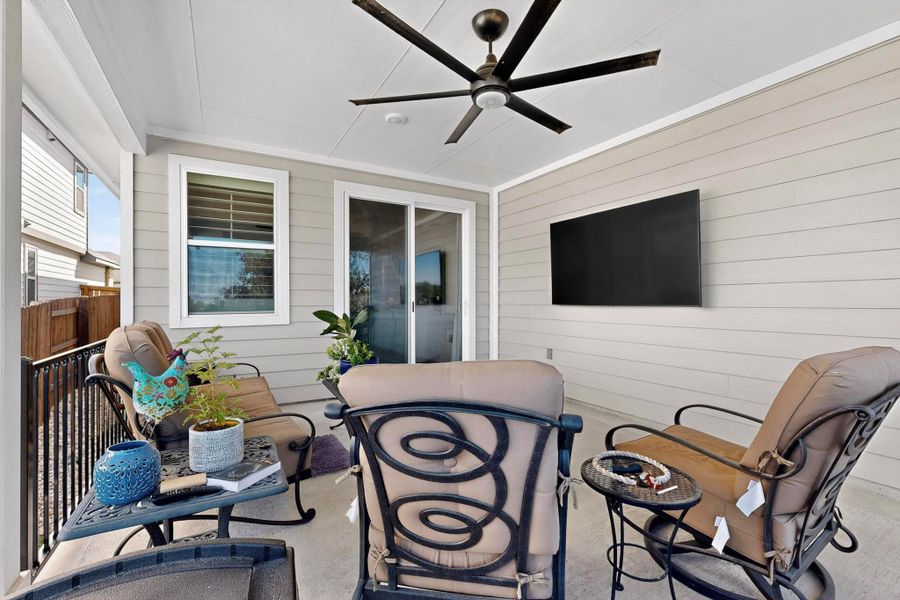 View of patio featuring a ceiling fan