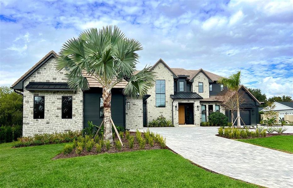 Front exterior of a new home in , Orlando, FL, highlighting curb appeal (Image 1). Front exterior of a new home in , Orlando, FL, highlighting curb appeal (Image 1).