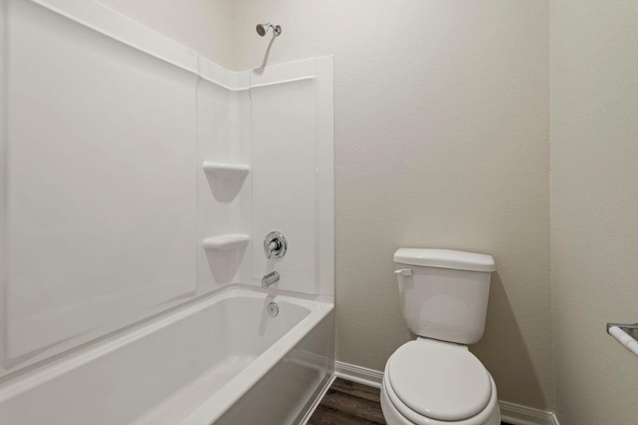 The secondary bathroom is centrally located in the home.