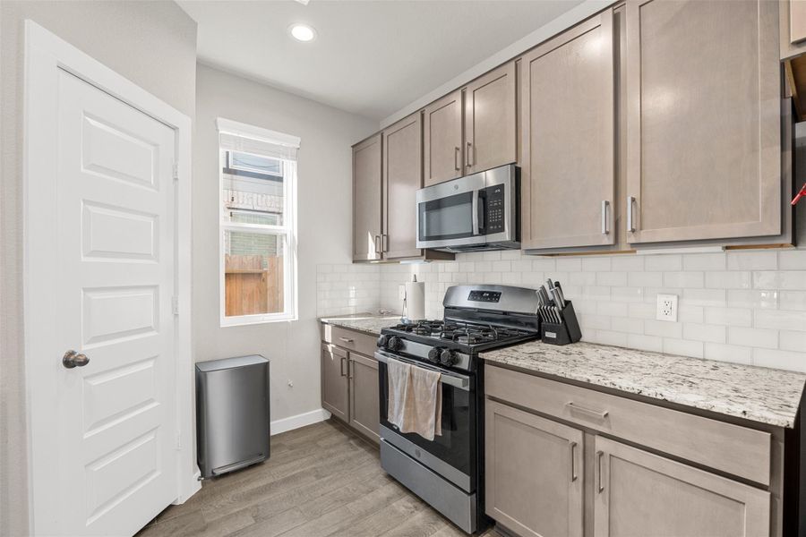 Furnished interior view inside a new home in Sunterra, Katy (Image 11).