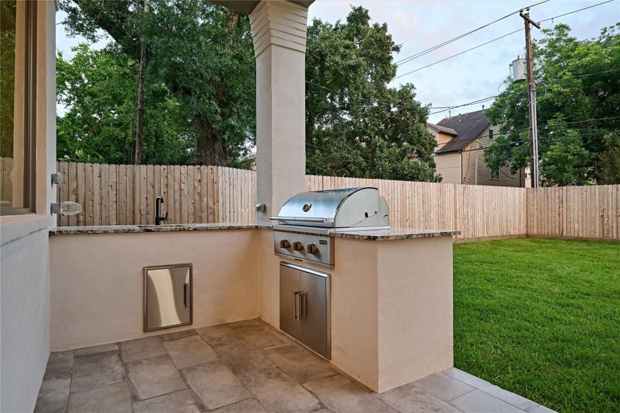 Outdoor Kitchen overlooking the backyard.