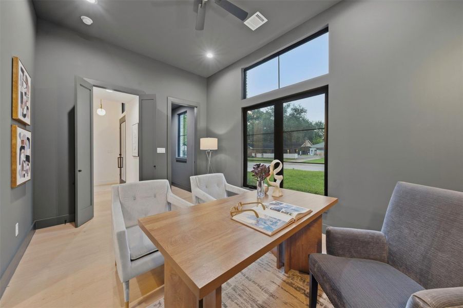 Versatile home office includes a large walk-in closet and private ensuite bath, offering the flexibility to easily function as an additional bedroom or guest suite if desired.