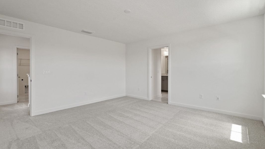 Large Primary Suite in the Mandarin model by DRB Homes at Trinity Place in Saint Cloud FL Large Primary Suite in the Mandarin model by DRB Homes at Trinity Place in Saint Cloud FL