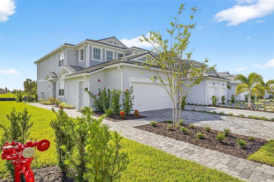 Front exterior of a new home in Wellen Park, Venice, FL, highlighting curb appeal (Image 2). Front exterior of a new home in Wellen Park, Venice, FL, highlighting curb appeal (Image 2).