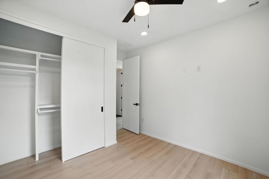 Unfurnished bedroom featuring recessed lighting, light wood-style floors, a closet, and ceiling fan Unfurnished bedroom featuring recessed lighting, light wood-style floors, a closet, and ceiling fan