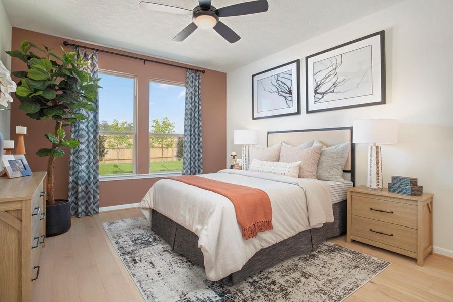 Come and unwind after a long day in this magnificent primary suite! This spacious room features engineered wood flooring, neutral paint, high ceilings with ceiling fan, and large windows!