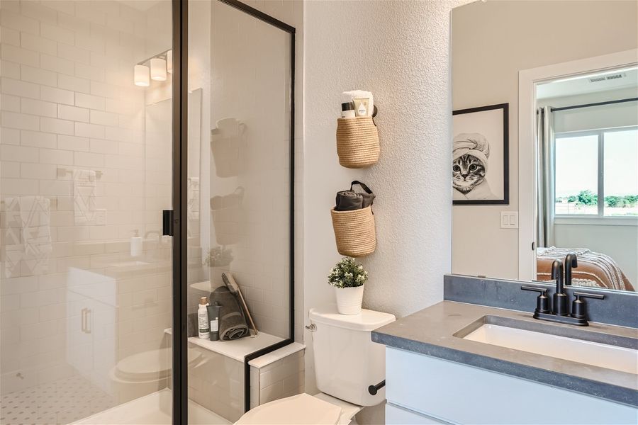 A bathroom with a glass shower. A bathroom with a glass shower.