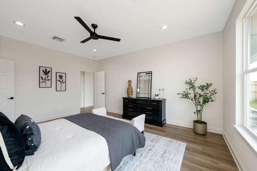 Bedroom featuring ceiling fan, wood finished floors, and recessed lighting Bedroom featuring ceiling fan, wood finished floors, and recessed lighting