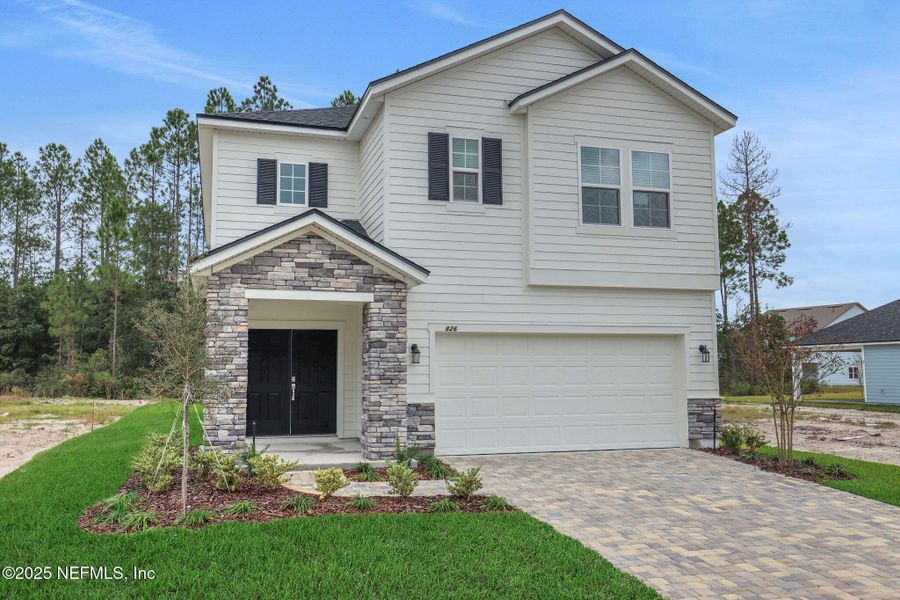 Front exterior of a new home in Brook Forest - Single Family Homes, St. Augustine, FL, highlighting curb appeal (Image 18). Front exterior of a new home in Brook Forest - Single Family Homes, St. Augustine, FL, highlighting curb appeal (Image 18).