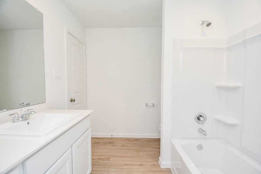 Furnished interior view inside a new home in Ladera Trails, Conroe (Image 10).