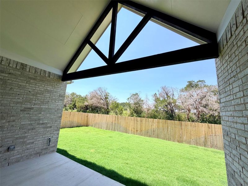 Exterior details and patio area of a home in Retreat at San Gabriel, Georgetown (Image 21).