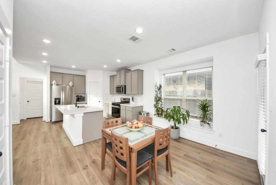 Spacious eating area overlooking the kitchen and main living space.