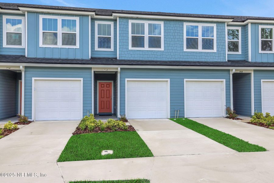 Front exterior of a new home in Kasen Oaks, Jacksonville, FL, highlighting curb appeal (Image 21).