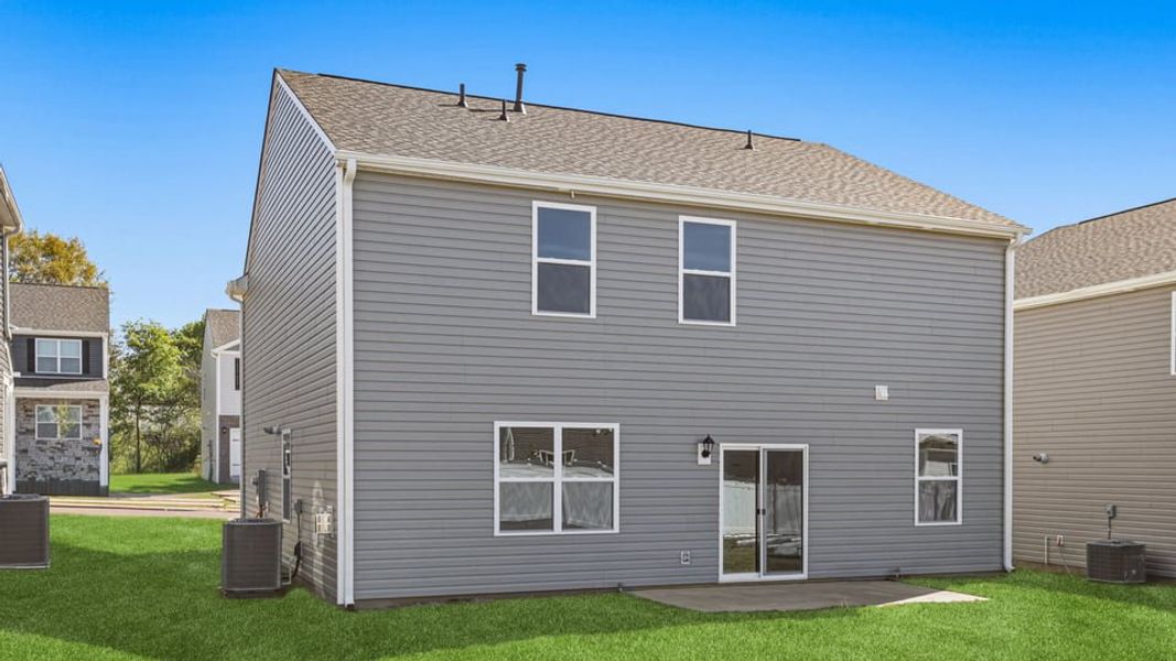 Exterior details and patio area of a home in Durbin Meadows Traditions, Fountain Inn (Image 4).