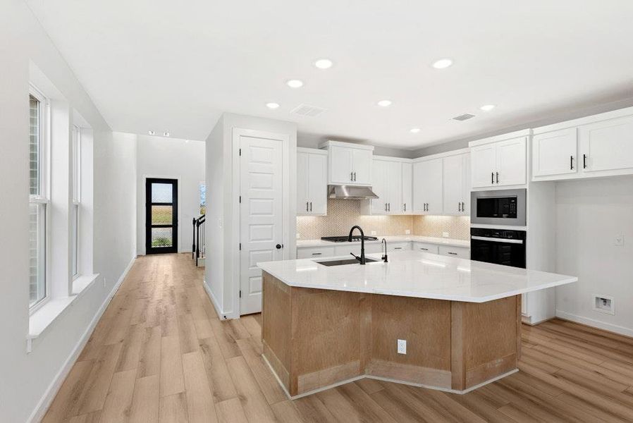 Furnished interior view inside a new home in University Heights, Round Rock (Image 8).