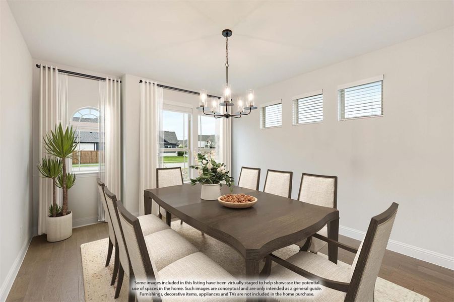 Dining room with dark wood table, eight chairs, chandelier, and hardwood floors Dining room with dark wood table, eight chairs, chandelier, and hardwood floors