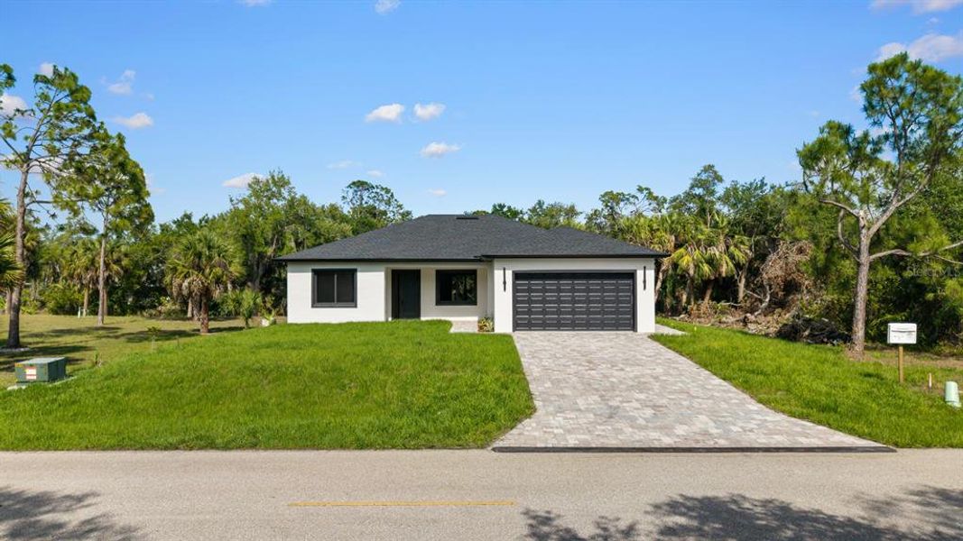 Front exterior of a new home in , Port Charlotte, FL, highlighting curb appeal (Image 23).