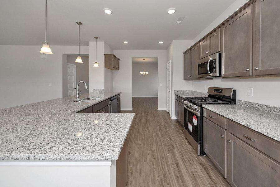 The Avery- Kitchen. Home under construction. Sample floor plan photo used for illustrative purposes only. Upgrades, selections options, and colors will vary.