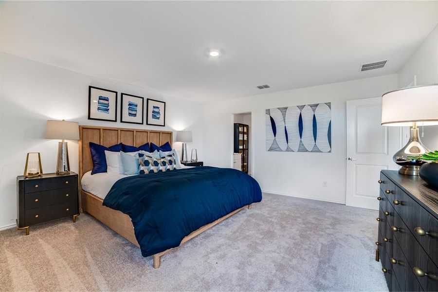 Bedroom featuring light carpet Bedroom featuring light carpet