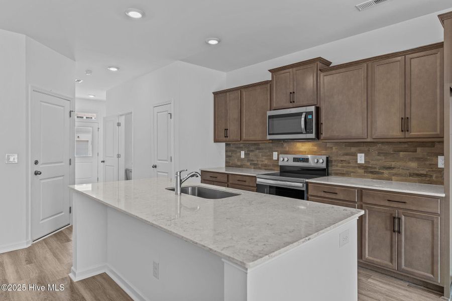 Furnished interior view inside a new home in Coastal Haven Townes, Leland (Image 9).
